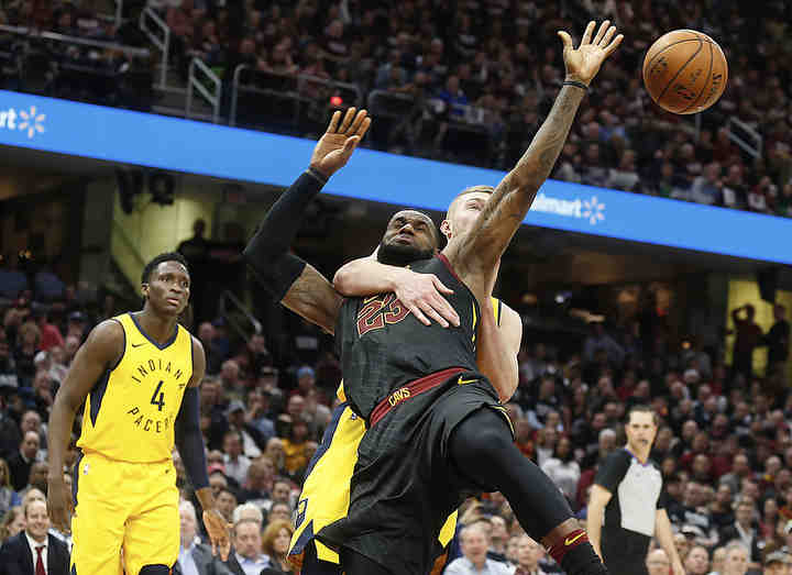 June - 1st place Sports
Leah Klafczynski/Akron Beacon Journal
Cleveland Cavaliers forward LeBron James is fouled by Indiana Pacers center Domantas Sabonis in the fourth quarter at Quicken Loans Arena in Cleveland. The foul was later changed to a flagrant 1.   (Leah Klafczynski / Akron Beacon Journal)